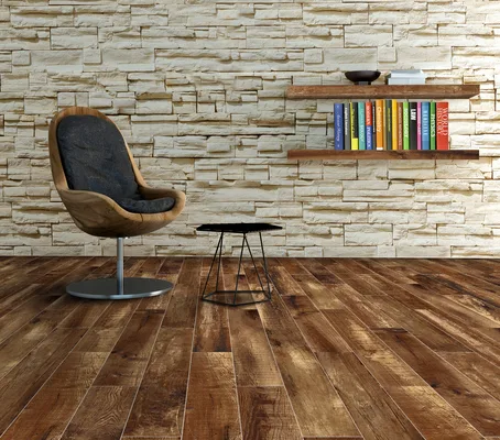 Wooden chair against stone brick wall with bookshelf